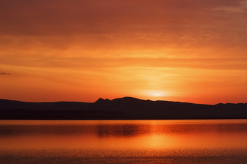Fototapeta na wymiar Russia. Khakassia. Sayan. Lake Shire. Morning. Rising Sun.