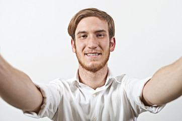 Young Adult Man Takes a Selfie