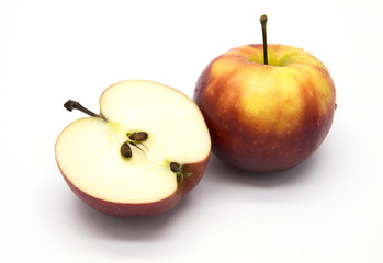 Red apple and half on white background