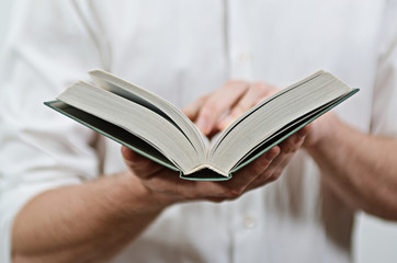 Young Adult Man's Hands Close-Up, Reading a Book
