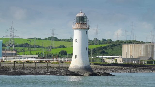 A small lighthouse in the river bank in Killimer Ireland. Killimer is a village in County Clare Ireland in a civil parish of the same name