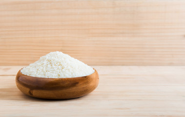 Fototapeta na wymiar basmati rice in a wooden bowl on wooden background, basmati rice, white rice, rice photo, raw rice.