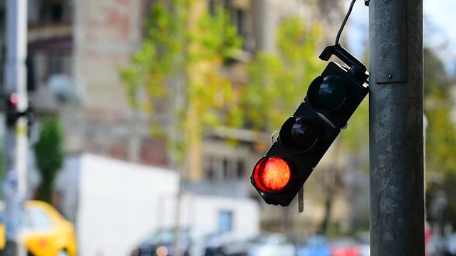 Broken traffic lights pole changing colors