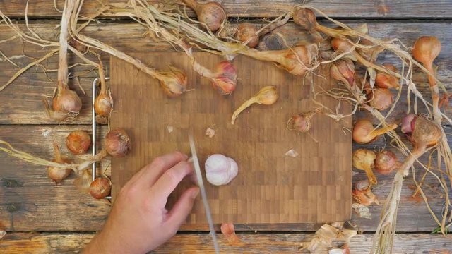 Slicing Onions on a rustic table - flat lay, 4K