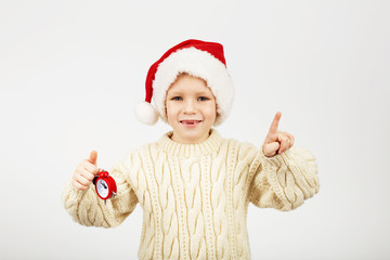 Portrait of happy joyful beautiful little boy wearing Santa hat