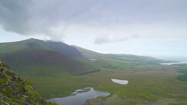 The view from the skyroad in Ireland the big mountains and the blue sky almost kissing while travelling