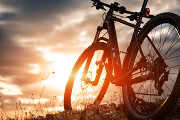 Mountain bike against sunset