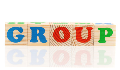 Group word formed by colorful wooden alphabet blocks, isolated on white background 