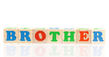 Brother word formed by colorful wooden alphabet blocks, isolated on white background 