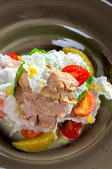 Sliced grilled beef steak with green leaves salad