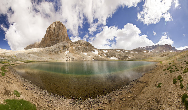 Fototapeta lake in mountains with big rock in Turkey Aladaglar