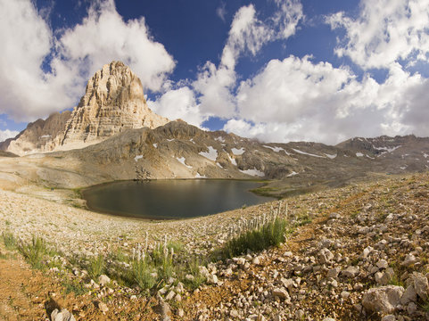Fototapeta lake in mountains with big rock in Turkey Aladaglar
