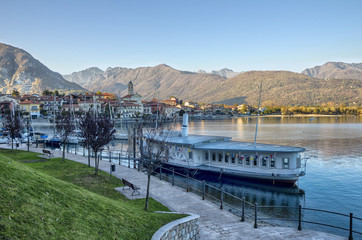 Lake Maggiore, Italy. Sunset Panoramic view of Lake Maggiore with yahts and passenger boats, Baveno near Stresa, Piedmont.
