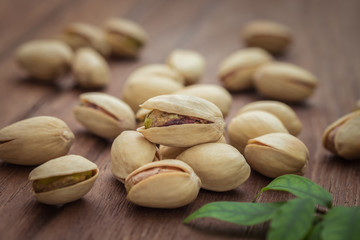 Pistachios on wooden table