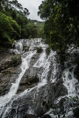 Closeup of beautiful waterfall in nature green tropical forest