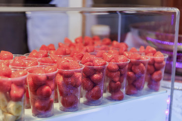 Sweets at Christmas fair. Traditional colorful and festive candies at the Market in Vienna in Austria. Selective focus. Strawberries