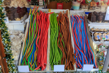 Sweets at Christmas fair. Traditional colorful and festive candies at the Market in Vienna in Austria. Selective focus.