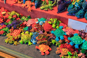 Colorful close up details of christmas fair market. Puppet turtle