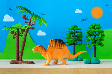 Spinosaurus toy model on wild models background © Noey smiley