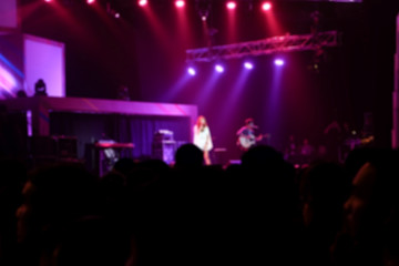 Fototapeta na wymiar Blurred background : Bokeh lighting in indoor concert.