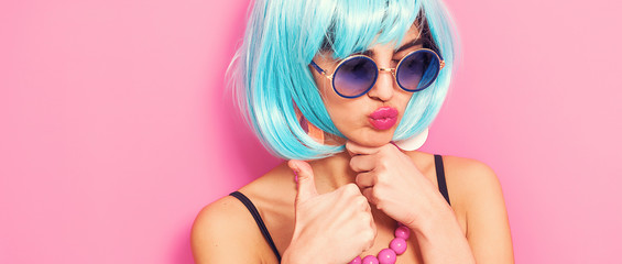 Pop girl portrait with thumbs up wearing weird accessories letterbox