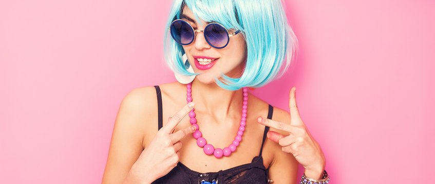 Weird and funny pop girl portrait wearing blue wig letterbox