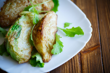 cabbage pieces fried in batter with salad