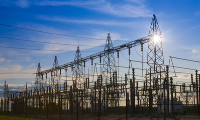 Sunset behind substation towers.