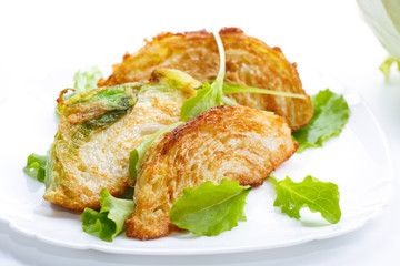 cabbage pieces fried in batter with salad