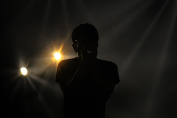 Silhouette of singer.