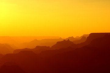 Panoramic View of Grand Canyon in yellow and red colors after sunset