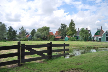 Traditional Dutch old wooden windmill in Zaanse Schans - museum village in Zaandam (Traditional village in Holland in Netherlands)