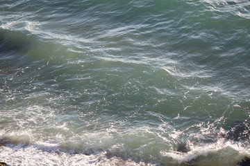 Turquoise sea waves near the shoreline