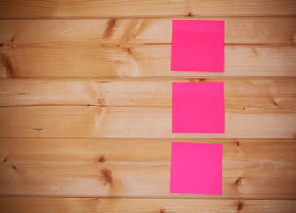 Sticky note on wooden background