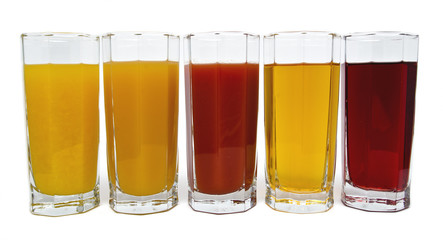 Isolated glasses of juice on white