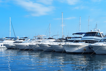 Many luxury yachts and boats in the harbor.