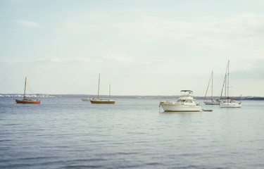 Fototapeta na wymiar Yachts and boats in the bay at morning.