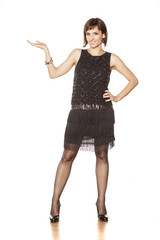 Fototapeta premium advertising middle aged smiling woman holding imaginary object in her hand