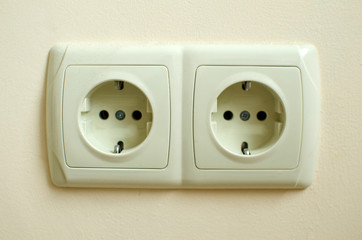 Two plastic plugs in the wall