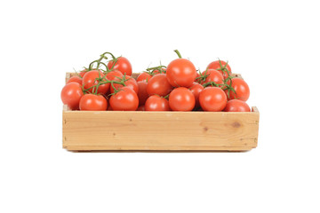 rustic basket of tomato fresh on wood 