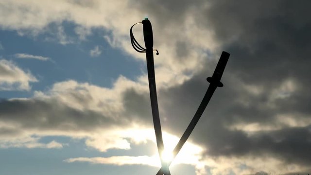 Sabers silhouette on sky background with clouds and sunset time lapse looks like after battle