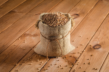 Buckwheat in bags on a wooden table