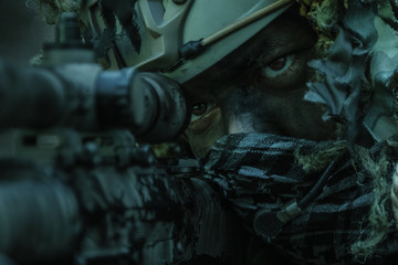 sniper wearing ghillie suit