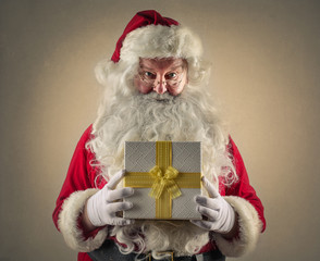 Santa Claus holding a box