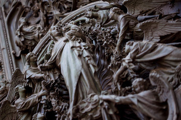 Detail of the Pieta scene in bas-relief at Milan's Cathedral doors,