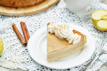 apple pie decorated with whipped cream