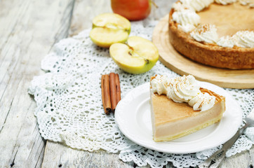 apple pie decorated with whipped cream