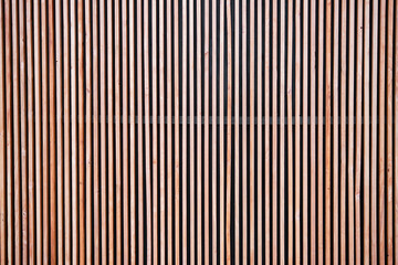 Wood cladding wall which various tone texture of wooden stripes use as partition or seamless fence...