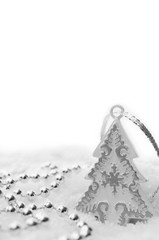 Silver Christmas Decorations with Snow Isolated on White Background. Copy Space for Text. Xmas postcard.