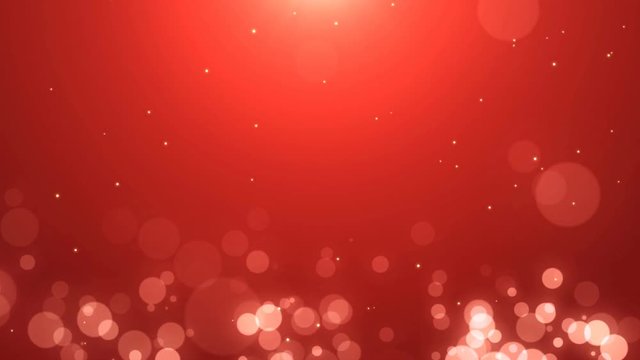 Soft red background with glowing golden and white particles. Looped animation